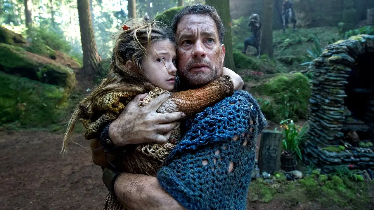 Zachary de Cloud Atlas cargando a un niño y luciendo preocupado. Zachary de Cloud Atlas cargando a un niño y luciendo preocupado.