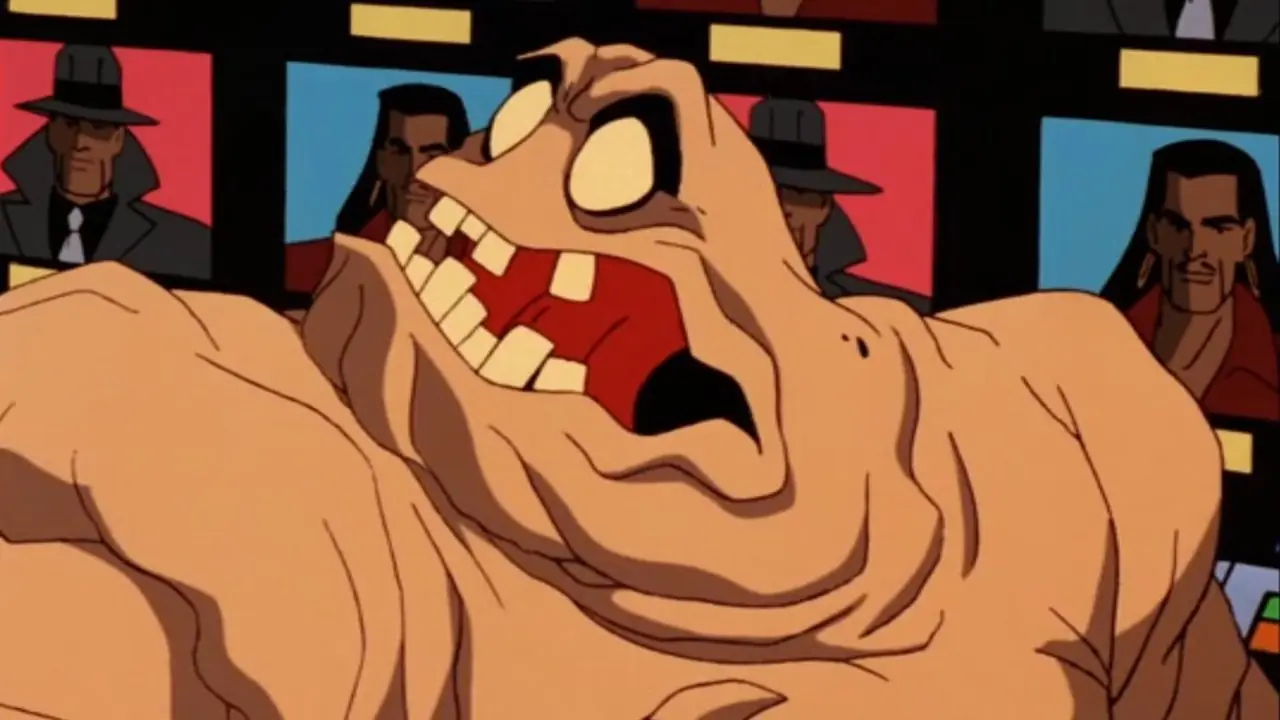 Clayface reacciona en estado de shock ante las pantallas de televisión que muestran sus papeles cinematográficos anteriores. Clayface reacciona en estado de shock ante las pantallas de televisión que muestran sus papeles cinematográficos anteriores.