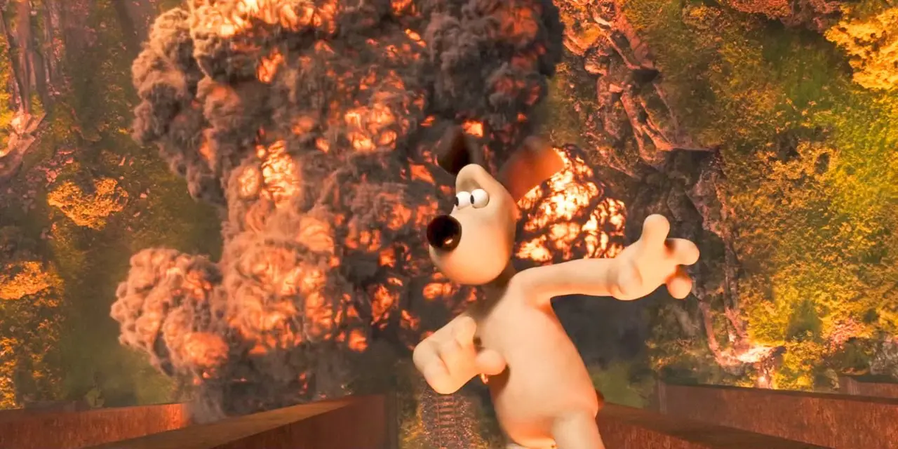 『ウォレスとグルミット: 復讐のモスト・ファウル』で爆発を背景に橋から落ちようとするグルミット